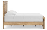 Ashley Furniture Makidern Bed with a sleek wooden frame and side panel, showcasing a modern design and rich finish.