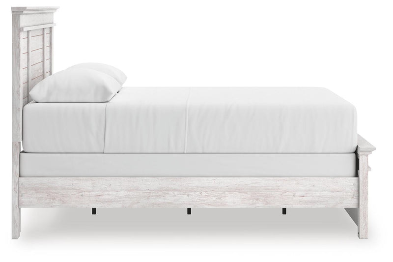 Ashley Furniture Makidern Bed showing a modern bed frame with a sleek headboard and neutral upholstery.