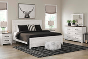 Ashley Furniture Gerridan bedroom set featuring a bed, nightstands, and dresser in a modern bedroom design.