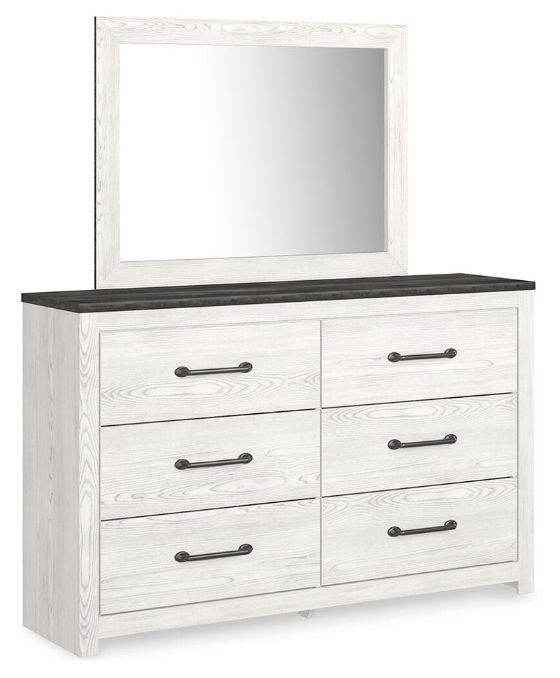 Ashley Furniture Gerridan bedroom set with a bed, nightstands, and dresser, shown from an angled view in a modern bedroom setting.