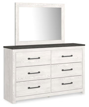 Ashley Furniture Gerridan dresser with matching mirror, showcasing sleek wood finish and modern design from an angled view.