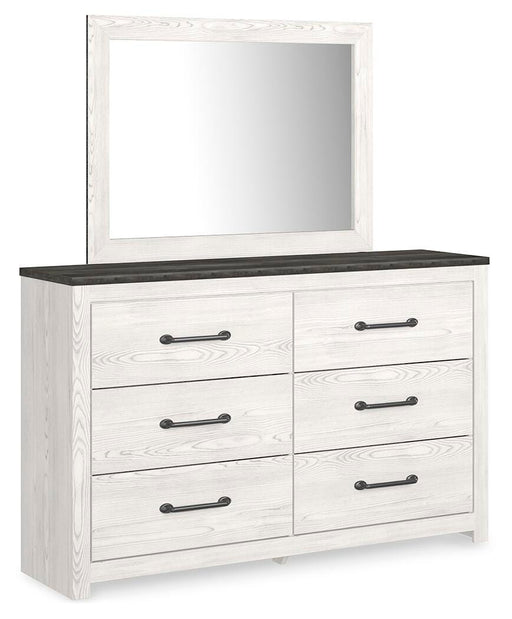 Ashley Furniture Gerridan dresser with matching mirror, showcasing sleek wood finish and modern design from an angled view.