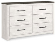 Ashley Furniture Gerridan Dresser in a closed view, showcasing its sleek design and multiple drawers for bedroom storage.