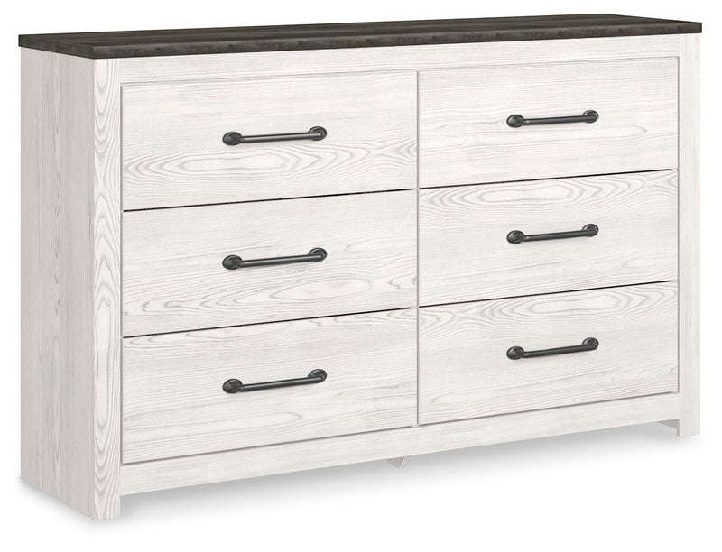 Ashley Furniture Gerridan Dresser in a closed view, showcasing its sleek design and multiple drawers for bedroom storage.