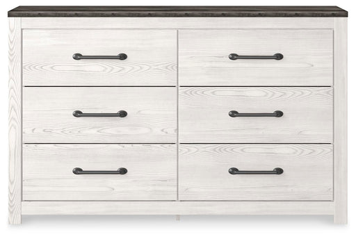 Ashley Furniture Gerridan dresser with sleek wood finish and modern hardware, featuring multiple drawers for ample storage.