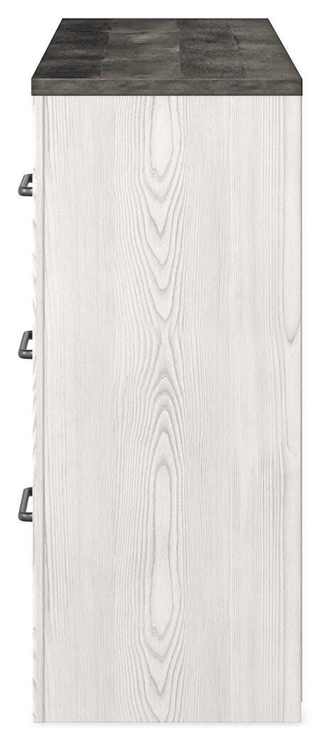 Ashley Furniture Gerridan dresser with sleek wood finish and multiple drawers, shown from a side view.