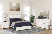 Ashley Furniture Gerridan Youth Bed with a wooden frame and headboard, featuring a classic design suitable for a child's bedroom.
