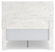 Ashley Furniture Gerridan Youth Bed with a sturdy wooden frame and classic design, shown from the back in a bedroom setting.