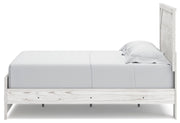 Ashley Furniture Gerridan bedroom set featuring a bed, nightstands, and dresser in a modern design, shown from a side angle.