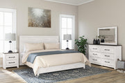 Ashley Furniture Gerridan bedroom set with a wooden bed frame, matching nightstands, and elegant bedroom decor.