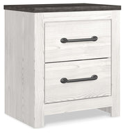 Ashley Furniture Gerridan nightstand with a closed drawer and sleek wood finish, shown from an angled side view.