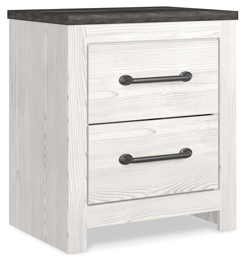Ashley Furniture Gerridan nightstand with a closed drawer and sleek wood finish, shown from an angled side view.