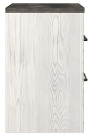 Ashley Furniture Gerridan bedroom set with a modern bed frame, matching dresser, and nightstands in a stylish bedroom setting.