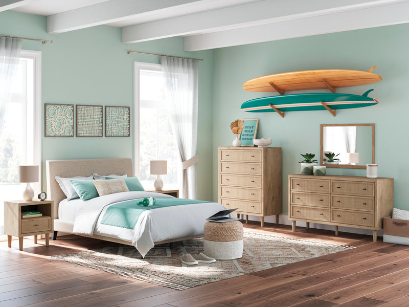 Ashley Furniture Cielden chest of drawers with a dark wood finish and sleek metal handles, showcasing a modern bedroom storage piece.