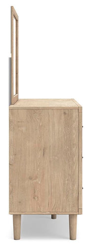 Ashley Furniture Cielden bedroom set featuring a bed with a wooden headboard and matching nightstands in a modern design.