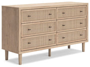 Ashley Furniture Cielden Dresser with sleek wood finish and multiple drawers, shown from an angled side view.