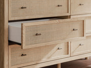 Ashley Furniture Cielden Dresser with wood finish and multiple drawers, detailed close-up of the dresser's hardware and texture.