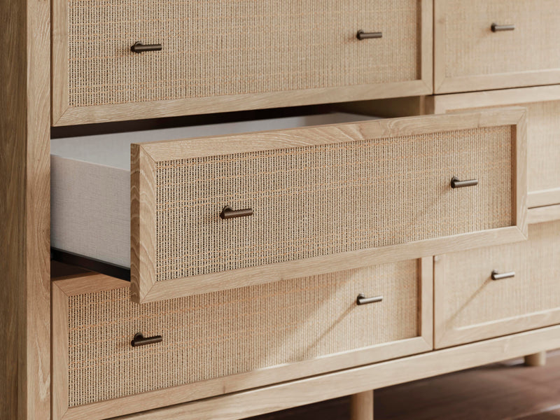Ashley Furniture Cielden Dresser with wood finish and multiple drawers, detailed close-up of the dresser's hardware and texture.