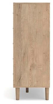 Ashley Furniture Cielden chest of drawers with four spacious drawers and a rustic wood finish, shown from a side angle.