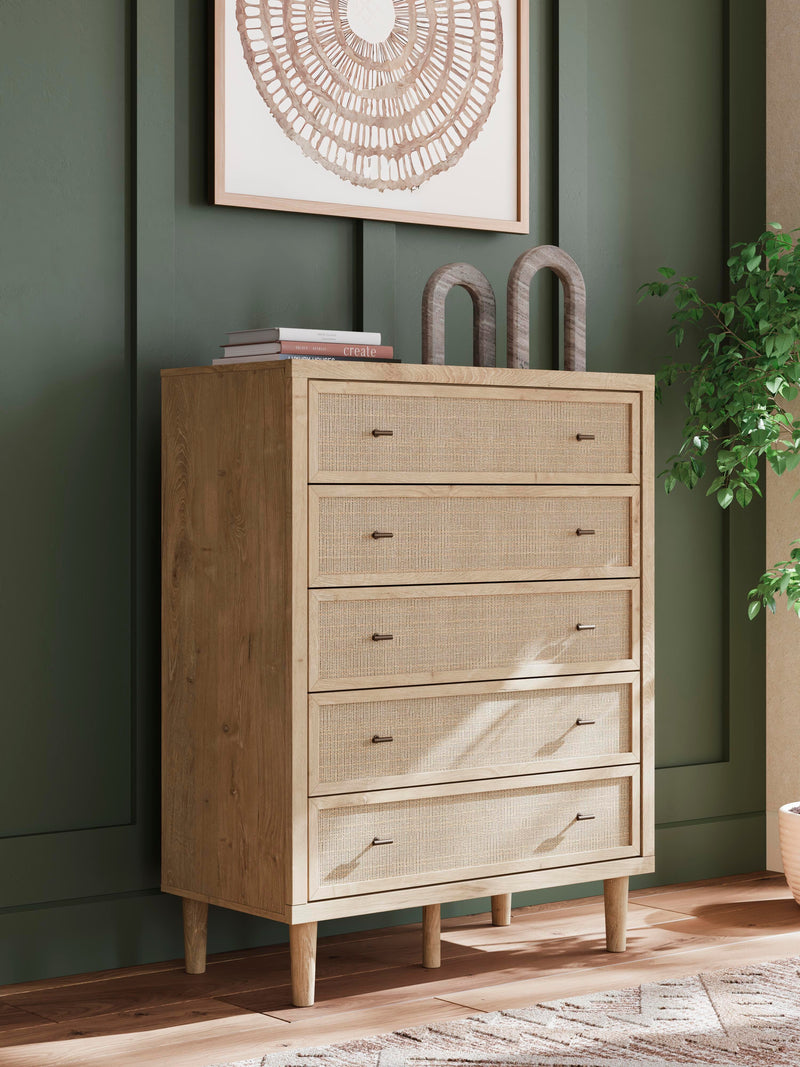 Ashley Furniture Cielden chest of drawers with multiple drawers in a modern wooden finish, shown in a well-lit room.