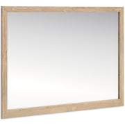 Ashley Furniture Cielden bedroom mirror showing a large, framed mirror with a sleek design, positioned at an angle.