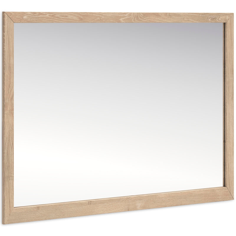 Ashley Furniture Cielden bedroom mirror showing a large, framed mirror with a sleek design, positioned at an angle.