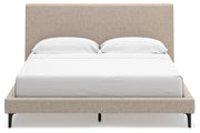 Ashley Furniture Cielden upholstered bed with roll slats, showcasing a stylish headboard in a modern bedroom setting.