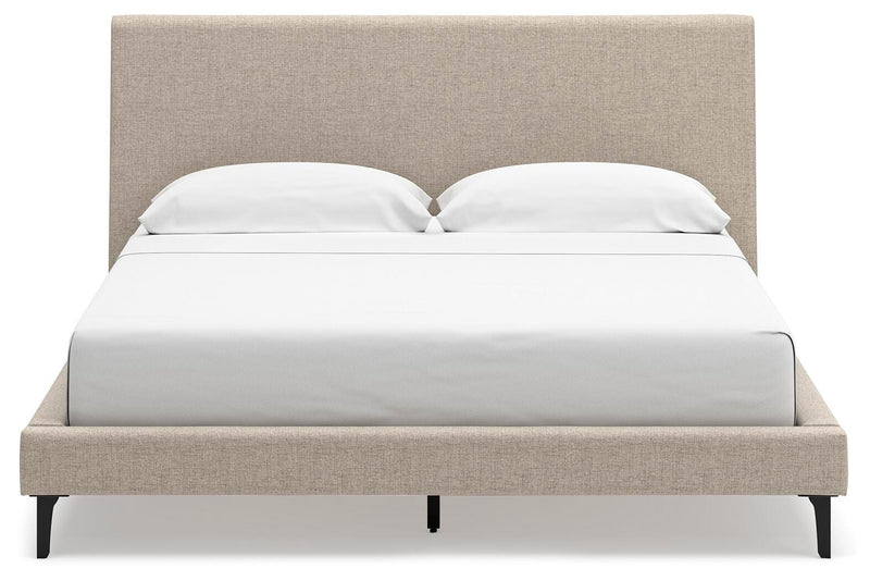 Ashley Furniture Cielden upholstered bed with roll slats, showcasing a stylish headboard in a modern bedroom setting.