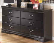 Ashley Furniture Huey Vineyard Dresser with wood finish and multiple drawers, showcasing a stylish bedroom storage solution.