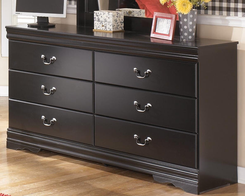 Ashley Furniture Huey Vineyard Dresser with wood finish and multiple drawers, showcasing a stylish bedroom storage solution.