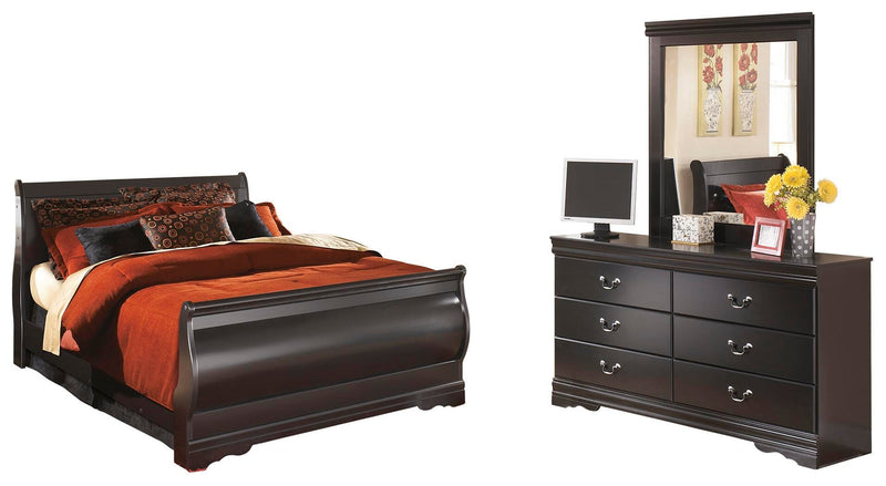 Ashley Furniture Huey Vineyard bedroom set with a bed, dresser, and nightstands in a rustic wood finish.