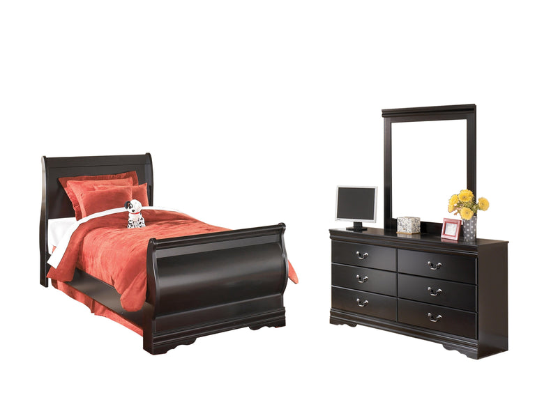 Ashley Furniture Huey Vineyard bedroom set featuring a bed, dresser, and nightstands with a rustic wood finish.