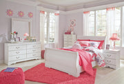Ashley Furniture Anarasia Bed with a classic wooden frame and elegant design, shown in a cozy bedroom setting.