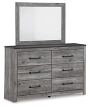 Ashley Furniture Bronyan bedroom set with a stylish bed, matching nightstands, and dresser in a modern bedroom layout.