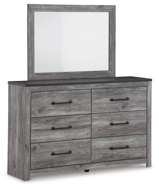 Ashley Furniture Bronyan dresser with matching mirror, featuring a sleek wood finish and modern design, shown from a side angle.