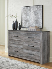 Ashley Furniture Bronyan dresser with multiple drawers and wood finish, showcasing its classic bedroom storage design.