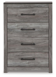 Ashley Furniture Bronyan chest of drawers with a sleek wood finish and modern design, featuring multiple drawers for ample storage.