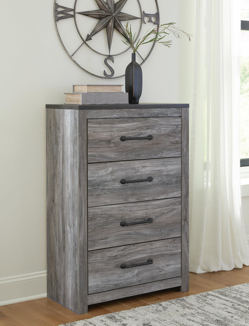 Ashley Furniture Bronyan chest of drawers with dark wood finish, featuring multiple drawers and modern design.