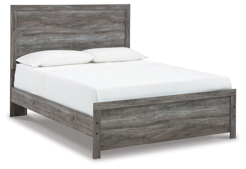 Ashley Furniture Bronyan bedroom set with a bed, nightstands, and dresser in a modern bedroom scene.