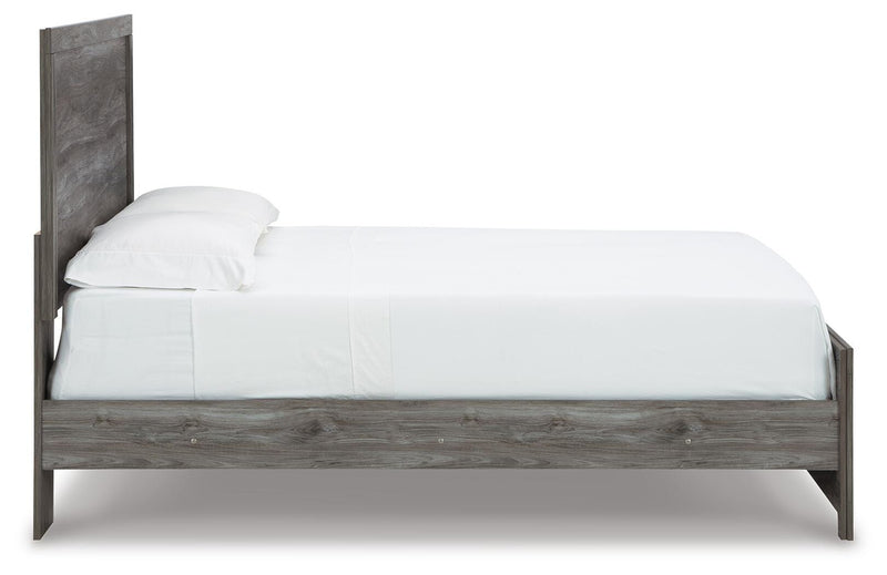 Ashley Furniture Bronyan bedroom set with a bed, nightstands, and dresser in a modern design, shown from a side view.