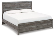 Ashley Furniture Bronyan bedroom set with a modern bed frame and matching nightstands, shown from an angled view in a bedroom setting.
