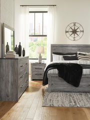 Ashley Furniture Bronyan bedroom set including a bed frame, nightstands, and dresser in a modern bedroom setting.