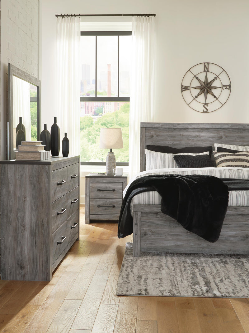 Ashley Furniture Bronyan bedroom set including a bed frame, nightstands, and dresser in a modern bedroom setting.