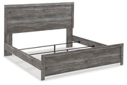 Ashley Furniture Bronyan bedroom set with a bed, nightstands, and dresser in a modern design, shown from an angled view.