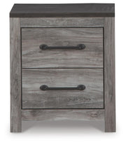 Nightstand from Ashley Furniture's Bronyan collection, featuring a sleek wood finish and modern design with a single drawer.