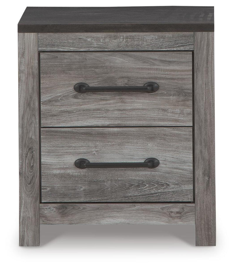 Nightstand from Ashley Furniture's Bronyan collection, featuring a sleek wood finish and modern design with a single drawer.