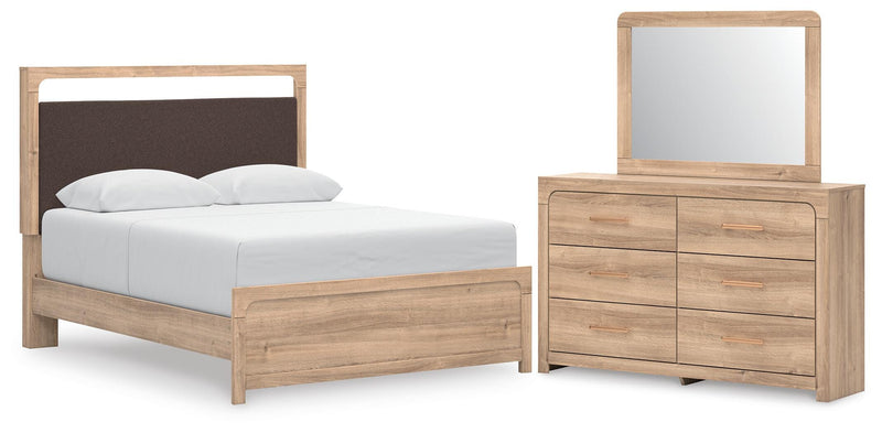 Ashley Furniture Kinlanni bedroom set with a stylish bed frame, matching nightstands, and a coordinated dresser in a modern bedroom.
