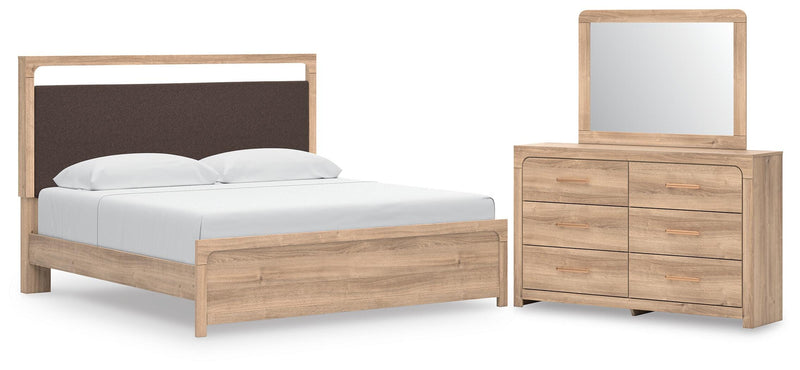 Ashley Furniture Kinlanni bedroom set with a bed, matching nightstands, and dresser in a modern bedroom scene.