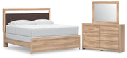 Ashley Furniture Kinlanni bedroom set with matching bed frame, nightstands, and dresser in a modern bedroom interior.