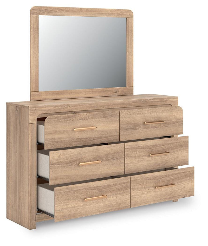 Ashley Furniture Kinlanni bedroom set featuring a bed with a padded headboard, matching nightstands, and coordinated decor.